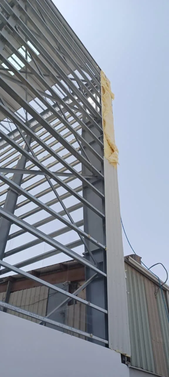 Steel structure erection on an industrial building.