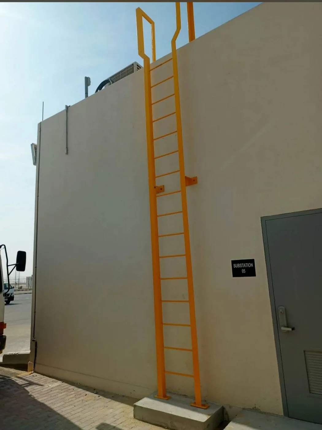 Caged access ladder fabrication and installation.